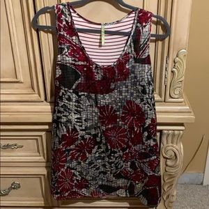 Mosaic red with grey circles top.